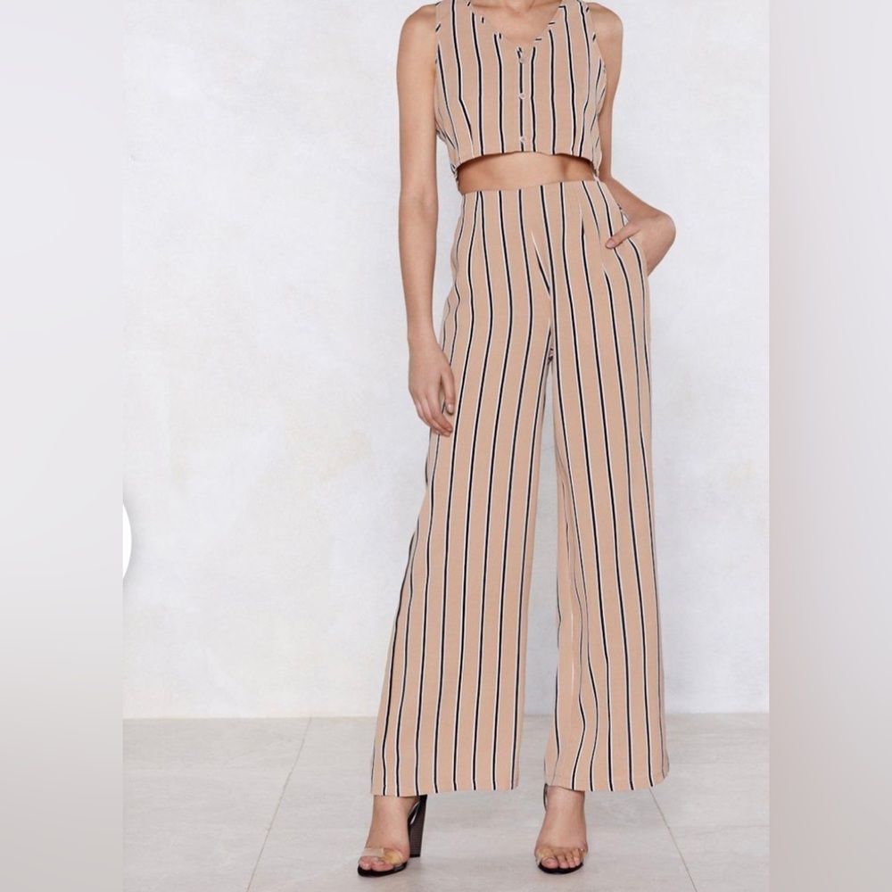 Striped, flare, pants with back zipper and pockets. One piece of a matching set.